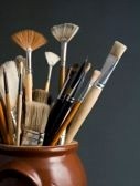357104-artist-brushes-in-a-pot-on-a-dark-grey-background